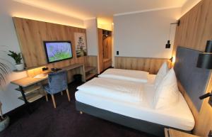 TV a/nebo společenská místnost v ubytování Hotel Thormählen