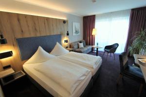 Postel nebo postele na pokoji v ubytování Hotel Thormählen
