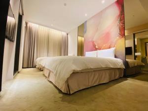 Voodi või voodid majutusasutuse Artinn藝築文旅-台北站前館 toas