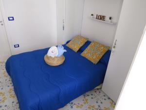 a bedroom with a bed with a towel on it at La torretta 13 - appartamento vista mare in Formia
