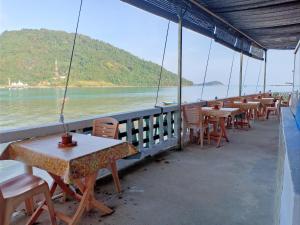 a row of tables and chairs on a boat at Suhaila Palace in Perhentian Islands