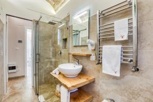 a bathroom with a sink and a shower at Romarina in Rome +20 photos