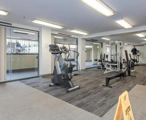 a gym with treadmills and cardio equipment in a building at 2BR 2Bath L8 Executive Apartment, in City Centre in Canberra