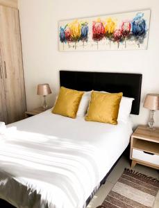 מיטה או מיטות בחדר ב-Alendo Apartments