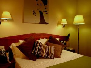 Letto o letti in una camera di Hotel Datini