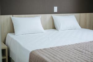 Postel nebo postele na pokoji v ubytování CALLAI HOTEL