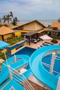 a view of the pool at the beach hotel or nearby at Aimberê Eco Resort Hotel in Coqueiro