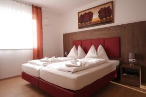 Postel nebo postele na pokoji v ubytování Gästehaus Munk