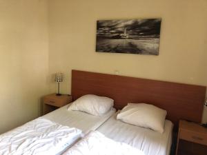 Postel nebo postele na pokoji v ubytování Vakantiehuis Kiki