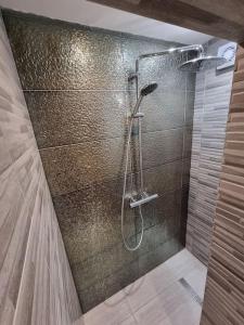 a bathroom with a shower with a glass wall at Windsor Retreat in shadow of the Castle. in Windsor