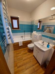 Kúpeľňa v ubytovaní Apartamenty Kapitanskie
