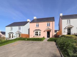 a large house with a driveway in front of it at 4 Llain yr Eglwys in Newport