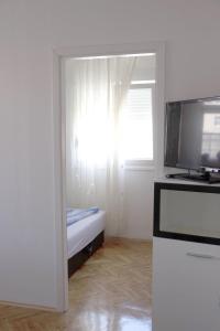 Kuchyň nebo kuchyňský kout v ubytování Apartments Tomisa
