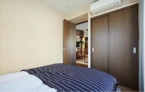 Säng eller sängar i ett rum på Kyodo House