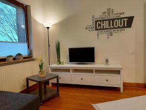 TV a/nebo společenská místnost v ubytování Ferienwohnung-Haus Holly