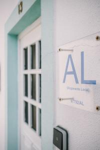 a sign on the side of a building at La casita 13 in Ferrel