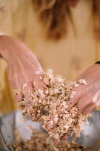 a person holding a handful of nuts in a bowl at La casita 13 in Ferrel