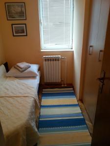 Un pat sau paturi într-o cameră la Apartment Ranka