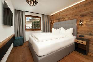 מיטה או מיטות בחדר ב-Runhof 47°10