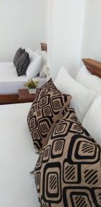 Postel nebo postele na pokoji v ubytování Mahaweli King's Villa