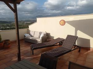 Posezení v ubytování Mirador Penthouse, centro y mar, ático grande