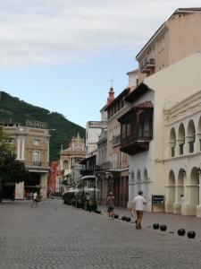 a group of people walking down a street at Departamento Caseros in Salta