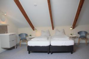 Кровать или кровати в номере Familiehuis Hannelore