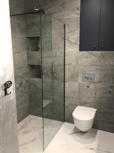 Koupelna v ubytování Sunset Resort Apartament Deluxe Blue + 22 fotografií