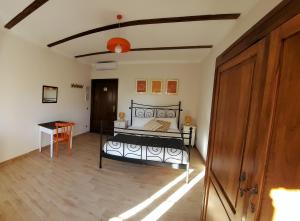 Postel nebo postele na pokoji v ubytování B&B L'orto del Geo