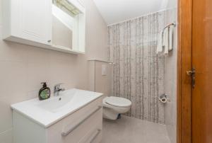 Kúpeľňa v ubytovaní Apartmani Češljar + 37 fotografií