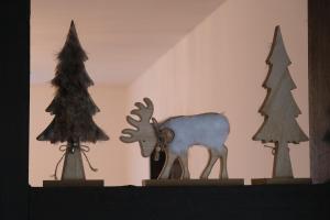 a figurine of a moose and trees on a shelf at Ursprüngliches Harzhaus für Aktive in Clausthal in Clausthal-Zellerfeld