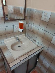 a bathroom with a sink and a mirror at Hotel Torre Fuerte in Venecia +61 photos