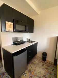 Kuchyň nebo kuchyňský kout v ubytování Hotel Nest