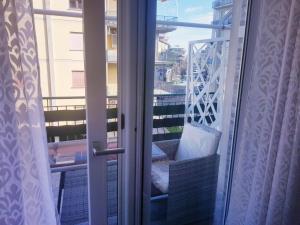 a sliding glass door to a balcony with a view at B&B Del Corso in Colleferro