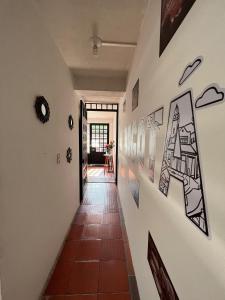 a hallway with art on the walls at Oporto 83 in Bogotá
