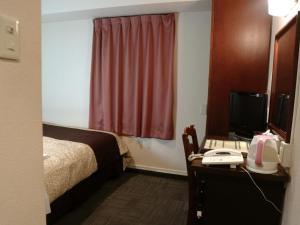 Säng eller sängar i ett rum på Hamamatsu Station Hotel - Vacation STAY 65844