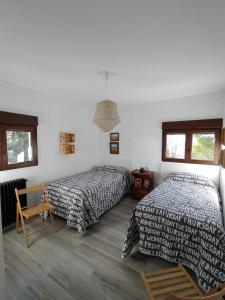 Posteľ alebo postele v izbe v ubytovaní Puerta Laguna - Casa con parcela