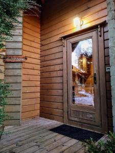 a front door of a house with a window at Le Ptit Beccon in Cruseilles