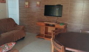 TV a/nebo společenská místnost v ubytování Casa Temporada