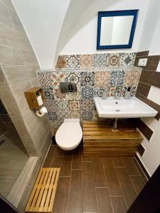 a bathroom with a sink and a toilet at Dorfel in Košice