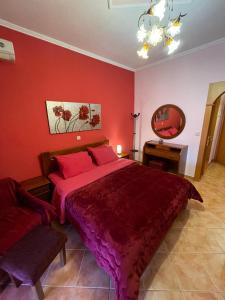 A bed or beds in a room at Asteras Hotel