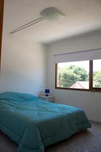 Una cama o camas en una habitación de Casabosque Apartamentos