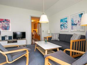 a living room with a couch and a table at 6 person holiday home in Rudk bing in Rudkøbing