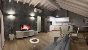a living room with a couch and a tv and a kitchen at Miragredos in Mombeltrán