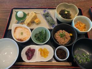 a tray of food with different types of food on it at ペンションニライカナイ in Awaren