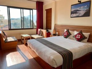 Giường trong phòng chung tại Sapa Garden Hotel