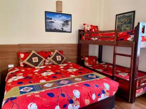 Postel nebo postele na pokoji v ubytování Sapa Garden Hotel