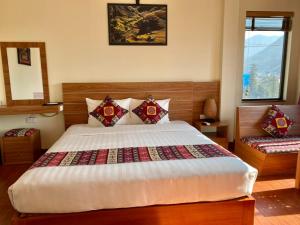 Postel nebo postele na pokoji v ubytování Sapa Garden Hotel
