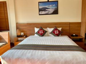 Postel nebo postele na pokoji v ubytování Sapa Garden Hotel