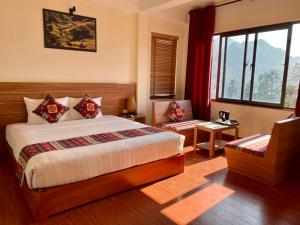 Postel nebo postele na pokoji v ubytování Sapa Garden Hotel